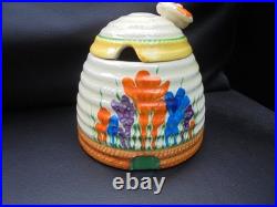 A Clarice Cliff bee hive honey pot in AUTUMN CROCUS pattern